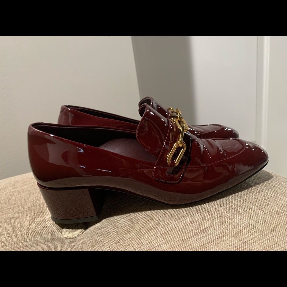 Burgundy Burberry loafers with gold accent